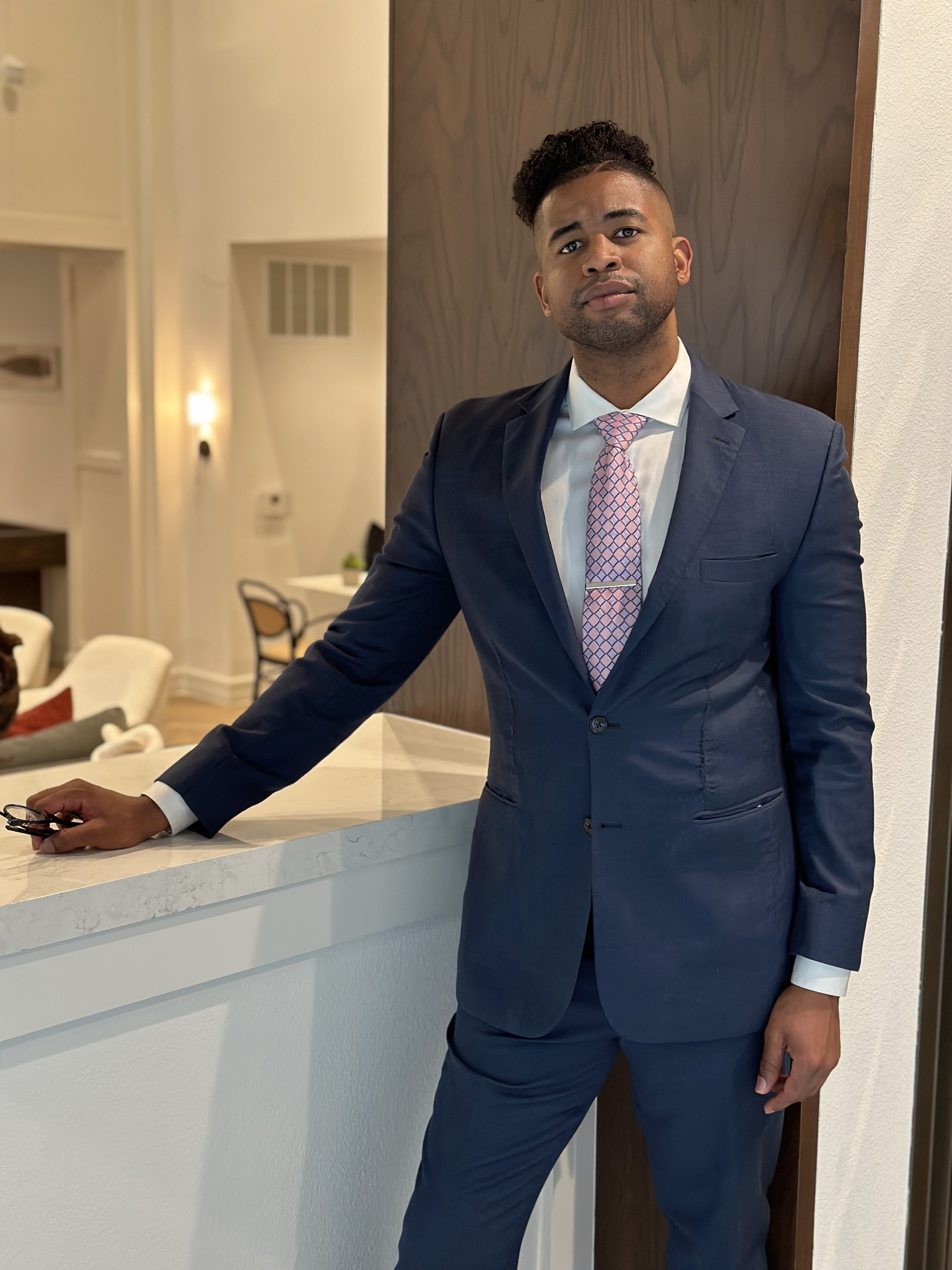 Joseph Robinson in a blue suit.